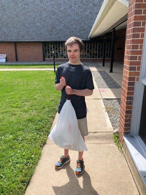 A client takes out the trash